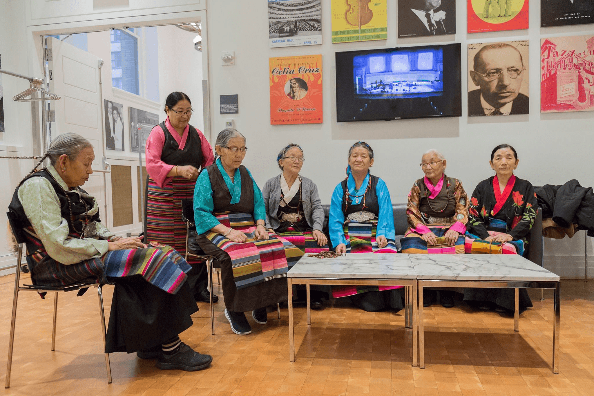 Tibetan elders backstage at Carnegie Hall in 2017, at a performance facilitated by our founder